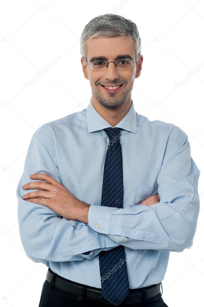businessman posing with arms folded