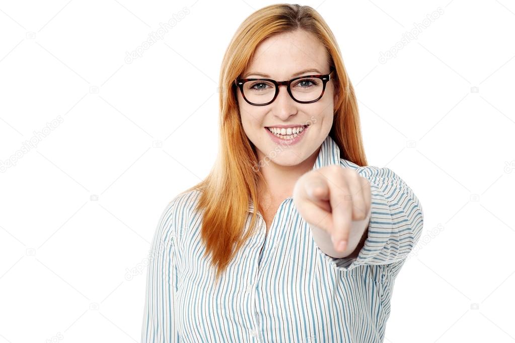 woman pointing towards the camera