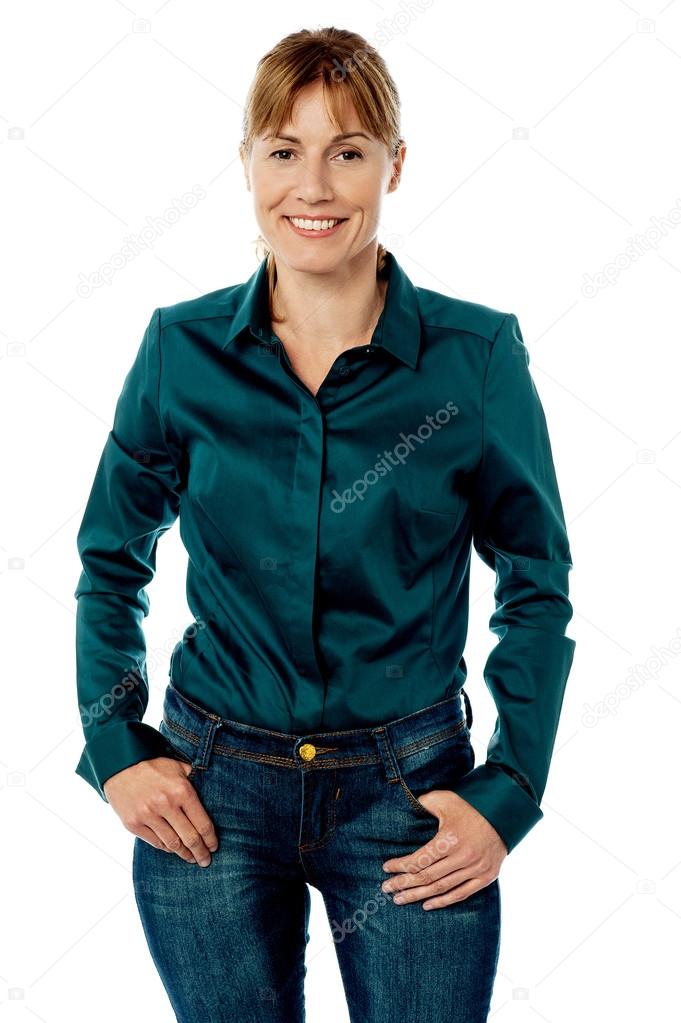 Stylish woman with hands in pockets