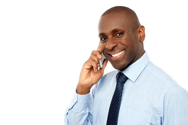 Businessman talking on mobile phone — Stock Photo, Image
