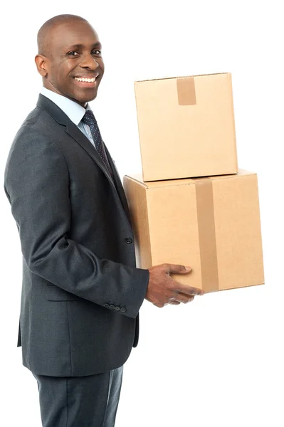 Businessman carrying cardboard boxes — Stock Photo, Image