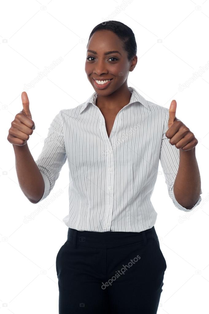 Businesswoman showing double thumbs up