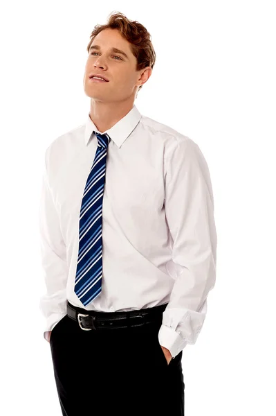 Businessman with hands in pockets — Stock Photo, Image