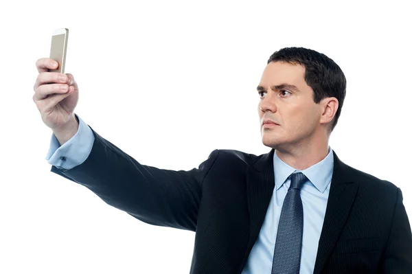 Businessman taking a selfie with smartphone — Stock Photo, Image