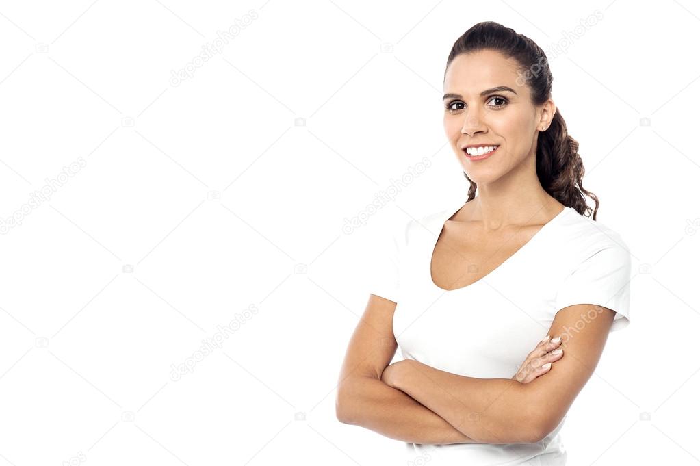 Smiling woman posing with arms crossed