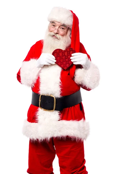 Santa claus met hartvormige geschenk — Stockfoto