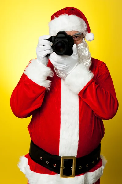 Santa claus att klicka på bilden — Stockfoto