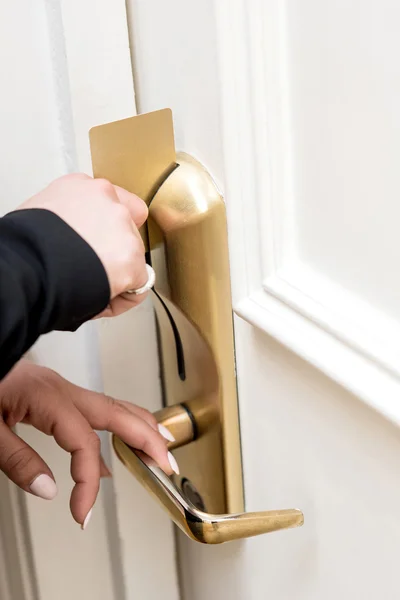 Woman opening door lock — Stock Photo, Image