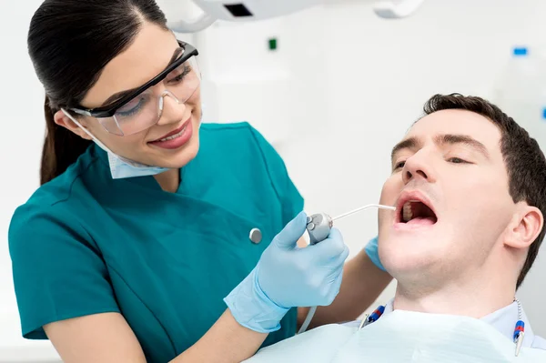 Patient getting teeth whitening treatment — Stock Photo, Image