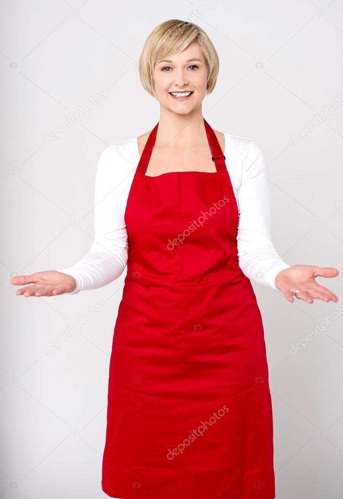 woman chef receiving customers cheerfully