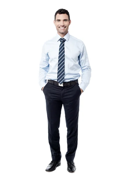 Businessman posing with hands in pockets — Stock Photo, Image