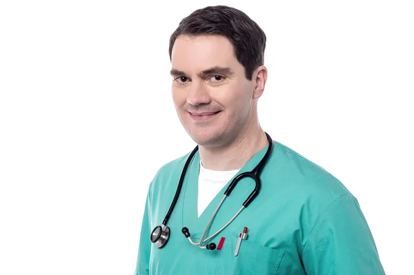 Happy male doctor in green uniform — Stock Photo, Image