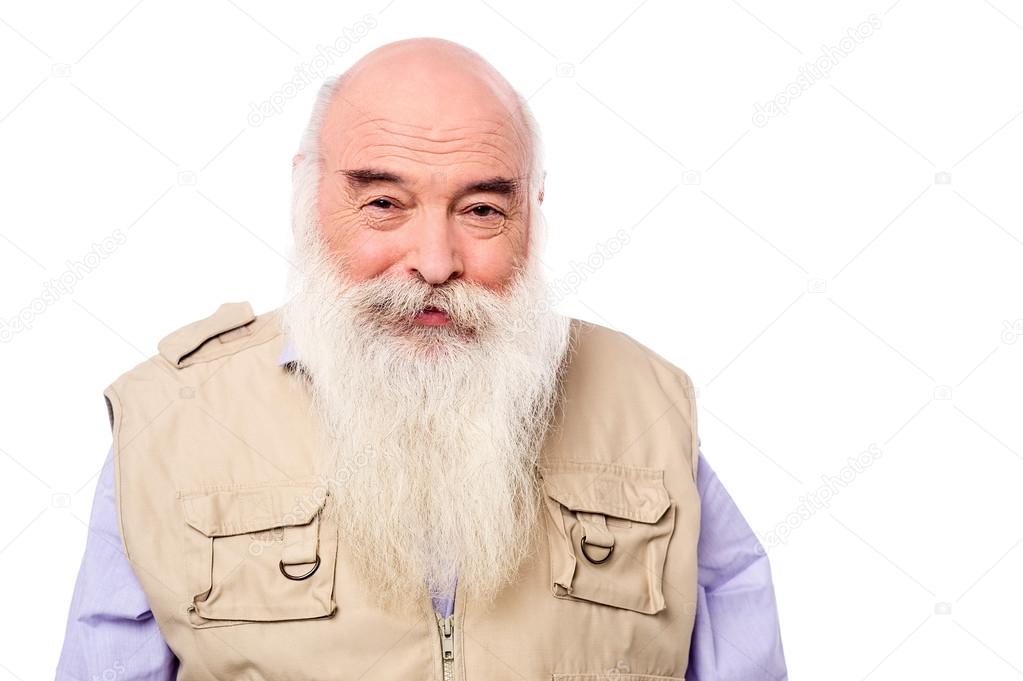 An old man posing casually to camera