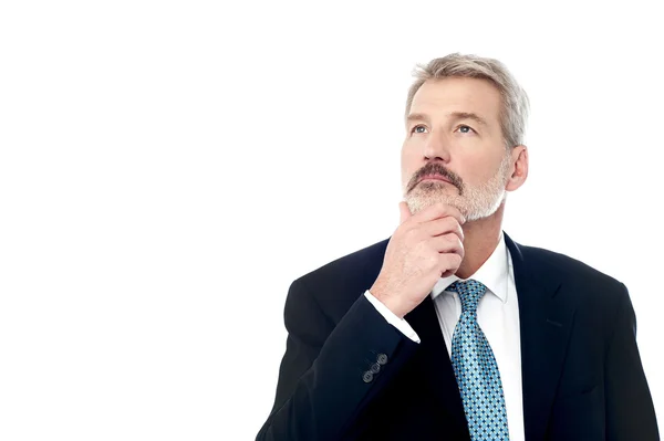 Senior businessman lost in thoughts — Stock Photo, Image