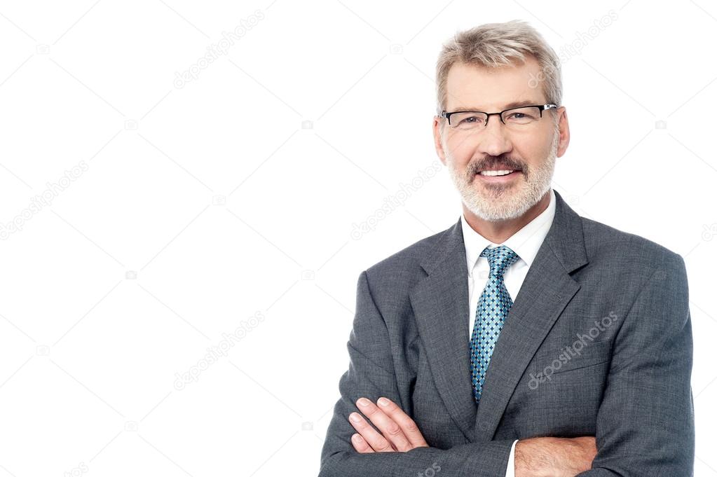 Mature businessman with crossed arms