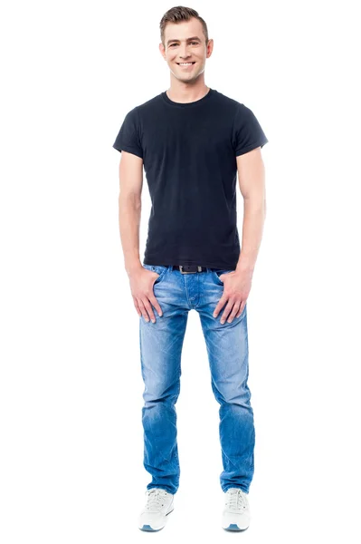 Young guy with hands in pockets — Stock Photo, Image