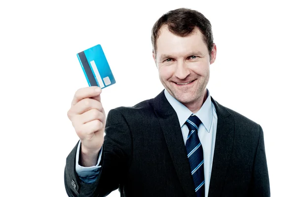 Businessman displaying cash card — Stock Photo, Image