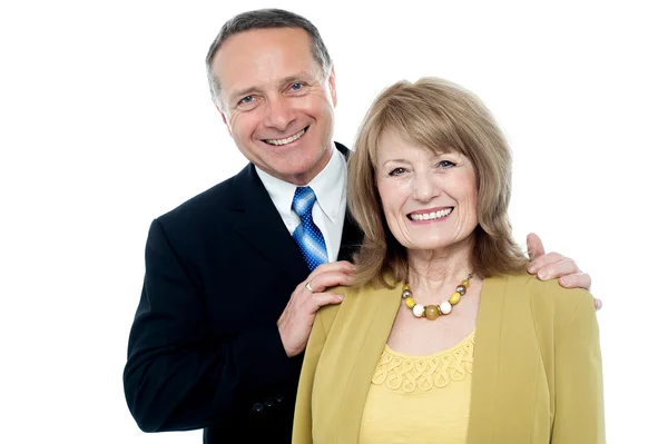 Loving elderly couple smiling at camera — Stock Photo, Image