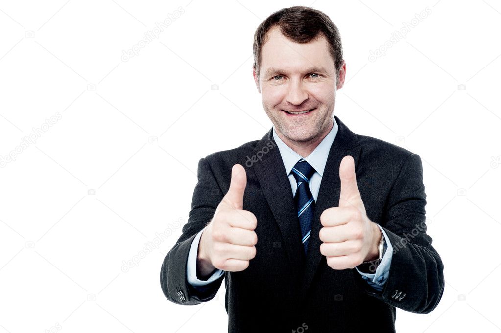 Businessman showing double thumbs up