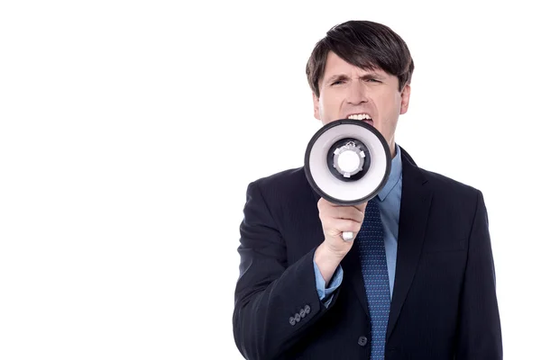 Businessman screaming on a megaphone — Stock Photo, Image