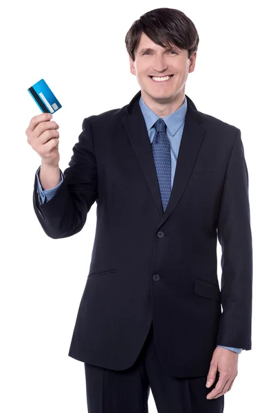 Happy boss displaying cash card — Stock Photo, Image