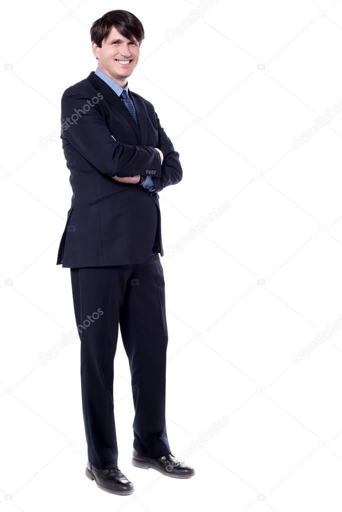 confident businessman with arms crossed