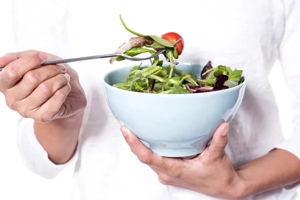 Woman holding a bowl of green salad — Stock Photo, Image