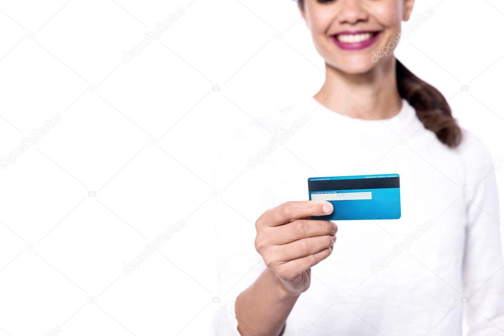 woman displaying her cash card