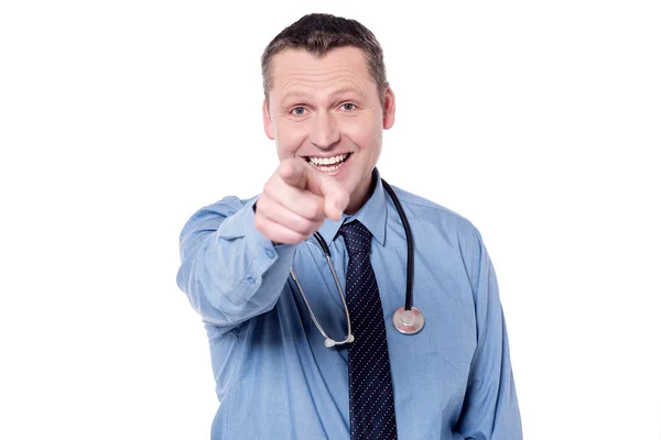 Male doctor pointing towards camera — Stock Photo, Image