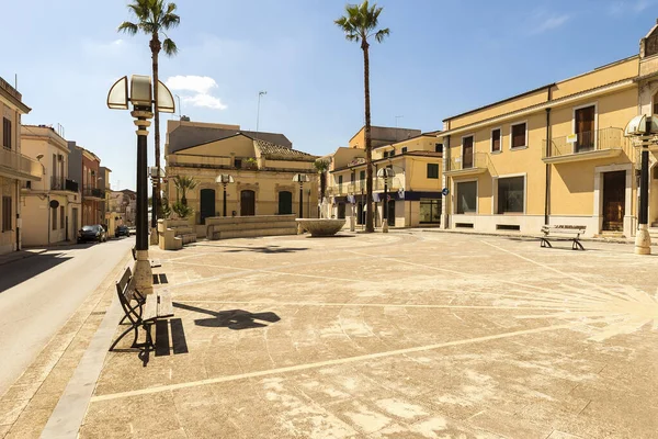 Taking a walk across the streets of Rosolini, Province of Syracuse, Sicily, Italy. (Crucifix Square).