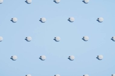 Christmas balls decoration pattern on blue background. Christmas, winter holidays, New year concept. Minimal style.