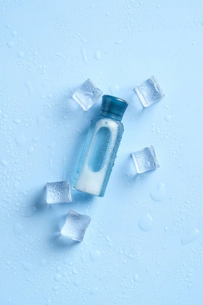 Transparent Cosmetic Bottle Ice Cubes Blue Background Clear Beauty Product — Stock Photo, Image