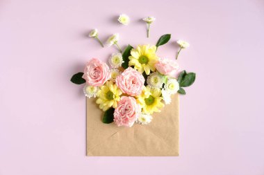 Open mail envelope with flowers on pink background. Romantic, Love letter, flowers delivery concept.
