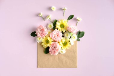 Open mail envelope with flowers on pink background. Romantic, Love letter, flowers delivery concept.