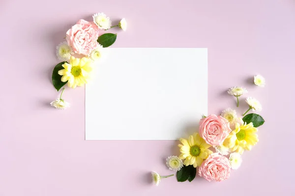 Blank paper card mockup and flowers on pink background. Happy Mother\'s Day, Birthday, anniversary concept.