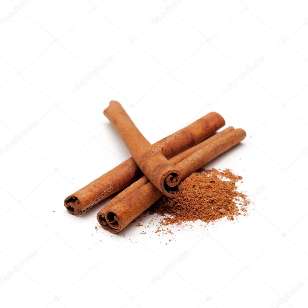 Cinnamon sticks and powder on white background