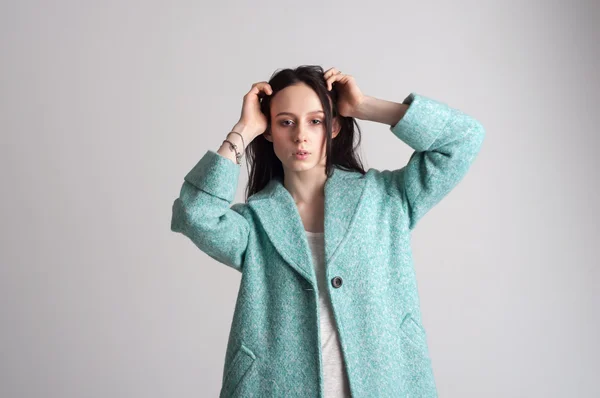 Portrait of fashionable young girl in cyan coat — Stock Photo, Image