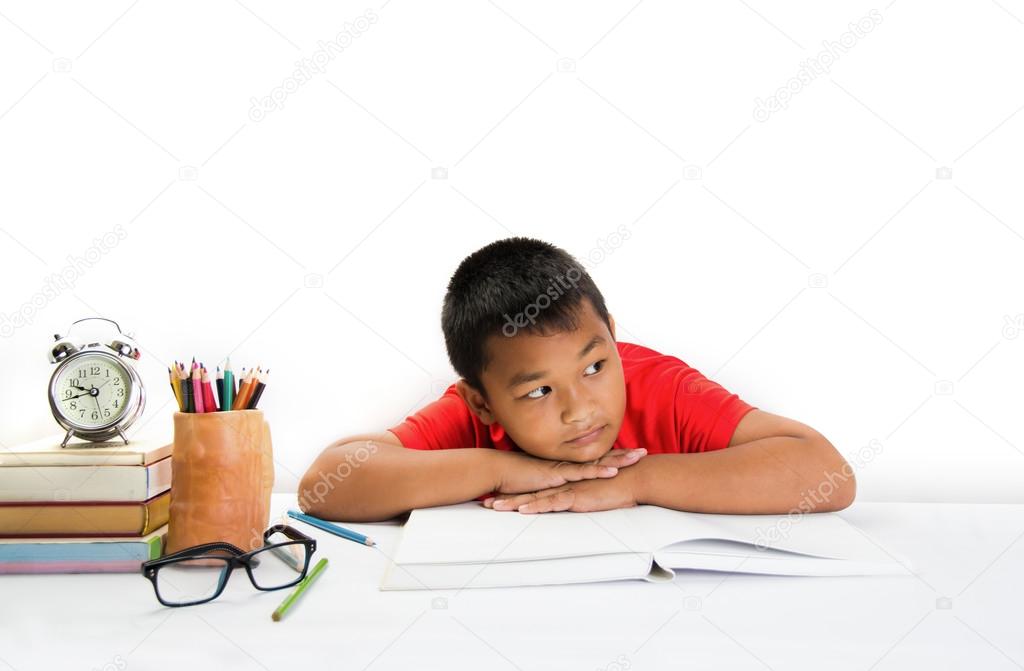 Tired child lying and sleeping on the books