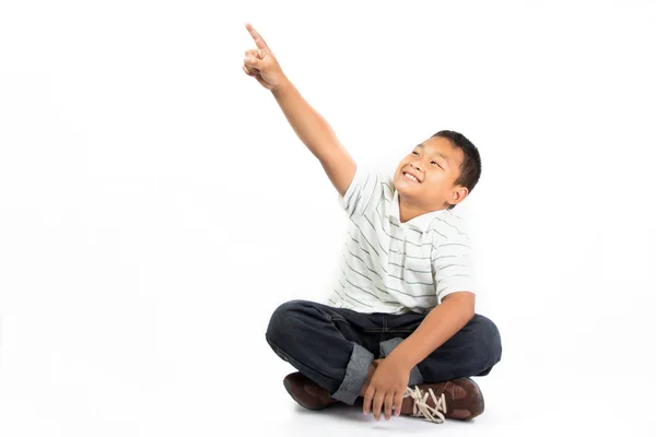 Gelukkige jongen wijzend met zijn vinger — Stockfoto