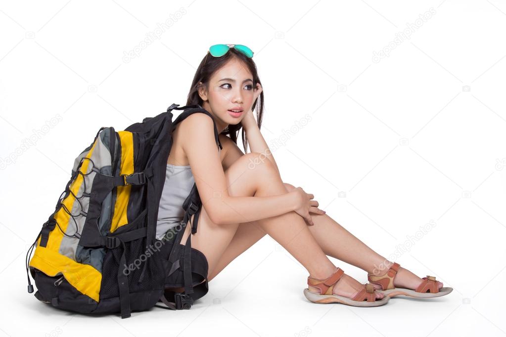 Young woman tourist with backpack