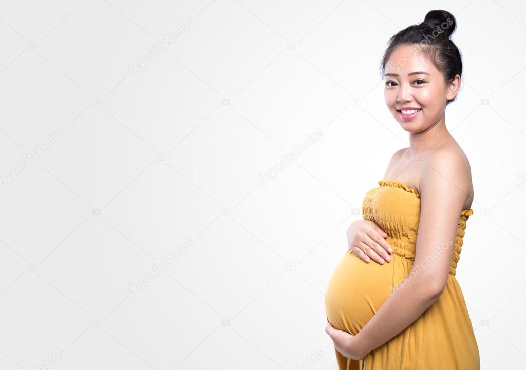 pregnant woman caressing her belly