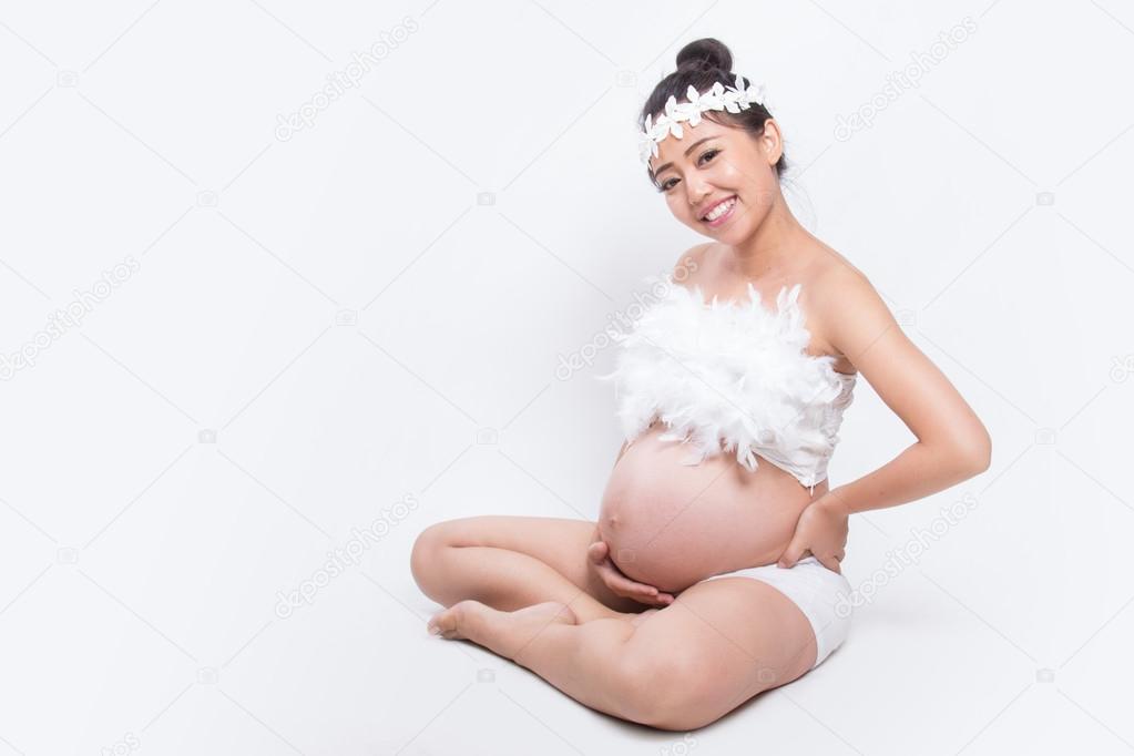 pregnant woman caressing her belly