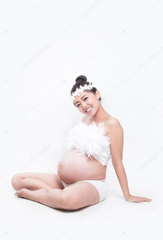 pregnant woman caressing her belly