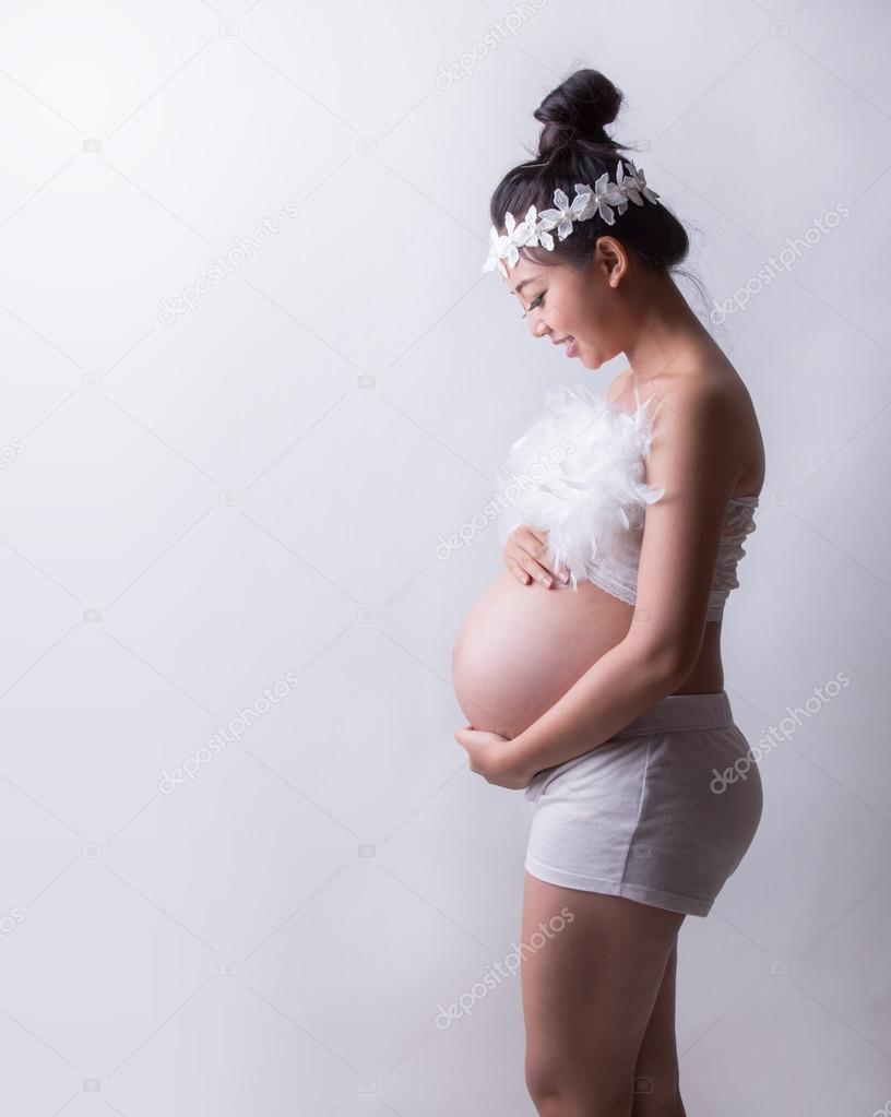 pregnant woman caressing her belly