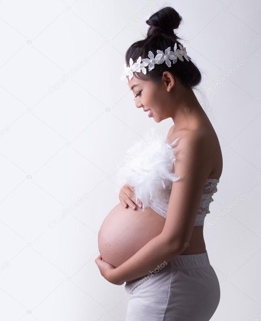 pregnant woman caressing her belly