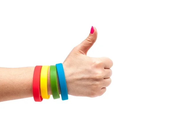 Colored latex bracelet on the arm — Stock Photo, Image