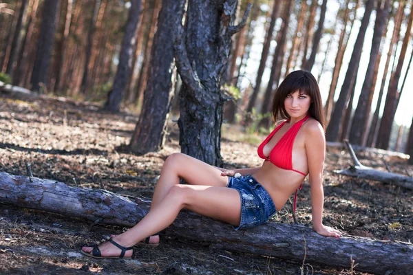 Cute girl near sandy mountain — Stock Photo, Image