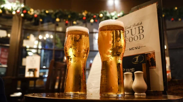 Glass of beers on a local pub — Stock Photo, Image