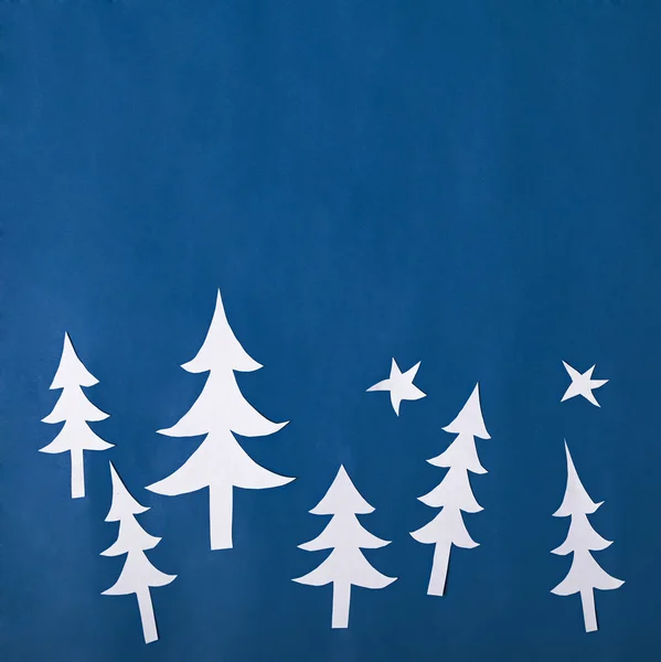 Christmas paper decorations on blue background — Stock Photo, Image