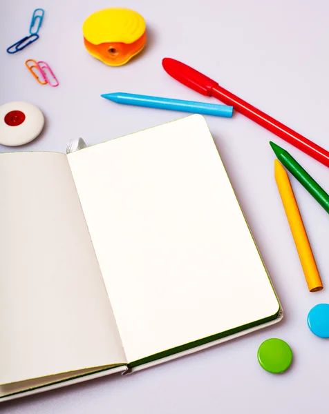 Open notepad with blank pages on table with office tools — Stock Photo, Image